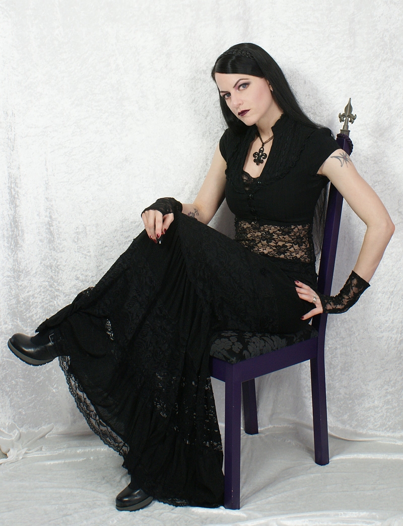 Brunette Gothic Girl wearing Black Long Dress and Black Shoes